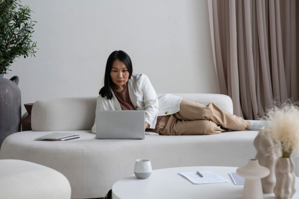 woman looking at laptop.